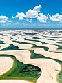 Image 4 Lençóis Maranhenses National Park Photograph: Julius Dadalti Lençóis Maranhenses National Park (Parque Nacional dos Lençóis Maranhenses) is a national park located in Maranhão state, in northeastern Brazil, just east of the Baía de São José. Protected since June 1981, the 383,000-acre (155,000 ha) park includes 70 km (43 mi) of coastline, and an interior of rolling sand dunes. During the rainy season, the valleys among the dunes fill with freshwater lagoons, prevented from draining due to the impermeable rock beneath. The park is home to a range of species, including four listed as endangered, and has become a popular destination for ecotourists. More selected pictures