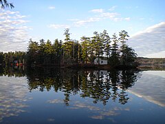 A clear view of tiny Loon Island on a perfectly calm day on Forest Lake in Gray