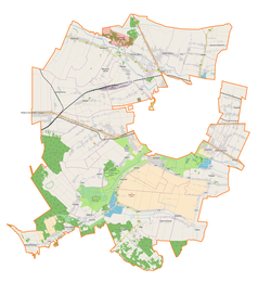 Mapa konturowa gminy wiejskiej Zamość, blisko centrum na lewo znajduje się punkt z opisem „Płoskie”