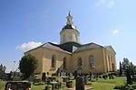 Alatornio Church, side view. Cemetery in front.