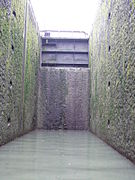 The cill exposed in the deep Pont de Flandre lock on the Canal Saint-Denis, Paris