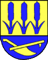 Wappen Hordorfs, Niedersachsen; Das Wappen des Ortes Hordorf in Niedersachsen weist mit der Darstellung dreier Rohrkolben und eines Schwenkpfluges auf die Urbarmachung des sumpfigen Geländes (ahd. hora Sumpf) hin.