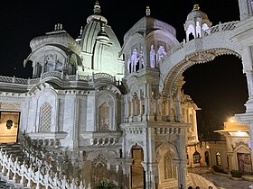 An ornate, elaborate marble building with a faceted dome and arched staircase.