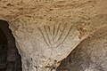 Menorah sculpté dans la Grotta del Carciofo