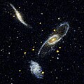 NGC 5560 (top galaxy) and NGC 5566 (middle galaxy) and NGC 5569 (bottom galaxy) from GALEX