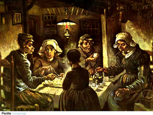 Two men and three women eating potatoes