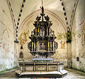 Berent Lorentzi altar aastast 1678. Altar on kaunistatud major Heinrich von Kurselli ja tema abikaasa Anna von Maydelli vappidega.