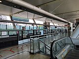 Dover MRT station (Singapore) with two platforms in use. The station is an infill station built along an existing line; thus, it takes a side platform structure.