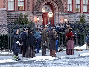 Actors in period clothing during filming