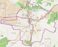 Mapa konturowa Ostrowa Wielkopolskiego, blisko centrum na prawo u góry znajduje się punkt z opisem „Parafia Miłosierdzia Bożego”