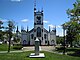 Front facade of St. John's Anglican Church as seen from across the church grounds