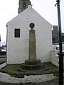 The Mercat cross at the 'jougs'