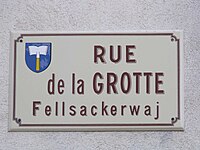 Street name sign with Alsatian name