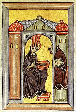 Hildegard van Bingen schrijft haar visioenen neer op wastabletten. Haar secretaris Volmar transcribeert ze op perkament. Miniatuur uit middeleeuws handschrift van de Scivias (1151).