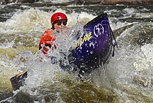 A Royalex Mad River Outrage canoe on the Hudson River in the Adirondack Park, New York State.