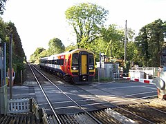 SWT train crosses the level crossing into the station