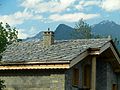 Image 8Alpine chalet being built in Haute-Maurienne (Savoy), the use of thick pieces of orthogneiss (4–7 cm) is by the strict architectural regulations in the region bordering the national parks of Vanoise-Grand Paradis. (from Alps)