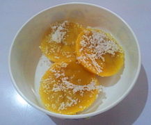 Puto kutsinta topped with grated coconut.