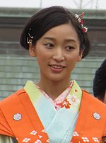 A Japanese woman wearing a kimono