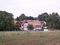 Wohnstallhaus, Seitengebäude, Scheune und ehemaliges Torhaus (Durchfahrt zugesetzt) eines Vierseithofes