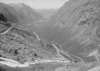 The deep U-shaped Isterdalen [no] valley in Norway ends abruptly giving rise to tall waterfalls. Trollstigen road climbs the steep cliffs of the trough end.