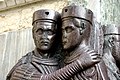 In questo particolare della scultura del Tetrarchi, conservata nella Basilica di San Marco, si può notare il tipico berretto pannonico, che divenne elemento caratterizzante dell'abbigliamento dei fanti romani tardo-imperiali.[83]