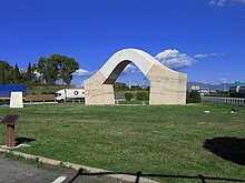 The arch-sculpture PortaRoma nearby the highway entrance at Fiano Romano