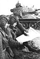 Image 7Soldiers in an East German tank unit reading about the erection of the Berlin Wall in 1961 in Neues Deutschland (from Newspaper)