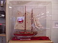 Model ship in trophy case.