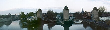 Photograph of wide river with bridges connecting the land on either side.