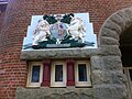 Royal coat of arms and Dieu et mon droit motto near entrance