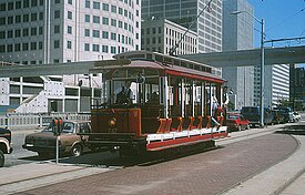 Trolley #247 stopped at the Jefferson Avenue passing siding, Detroit People Mover track overhead in the background