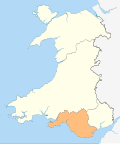 A map of Wales in yellow with an area in green (about 10%) at the top (north)