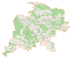 Mapa konturowa powiatu niżańskiego, w centrum znajduje się punkt z opisem „Ulanów”