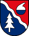 Halbgefüllte Retorte im Wappen von Lenzing, links zeigend