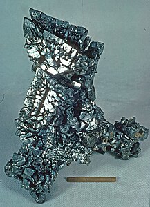 Acanthite. Locality: Chispas Mine, Arizpe, Sonora, Mexico. Scale is one inch with a ruled line at one cm.