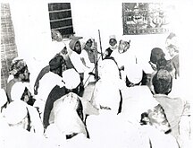 Moulana Peer Sahvi Shah delivering speech