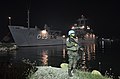 A Brazilian Marine stands guard as NDCC Almirante Saboia docks in Port-au-Prince, 2013.