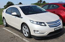 Slightly sloped three-quarters front view image of a white liftback with Holden badging and short suspension.