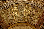 The mosaics in the voussoirs of the mihrab arch