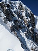Massive snow cornices line the summit ridge of Siula Grande, and are a characteristic feature of this peak.