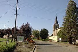 The church and surroundings in Le Mesnil-Véneron