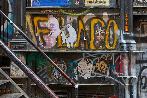 Cast Iron Warehouse on 16 Cortlandt Alley. The cast iron stamp by producer "D.D. Badger" is well preserved underneath posters and paint.