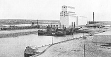 harbour with ships and grain elevator