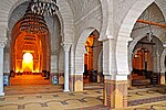 Prayer hall, with the central nave leading to the mihrab (left)