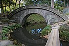 A full circle forms due to the shape and reflection of Engetsu-kyō stone bridge at Koishikawa-Kōrakuen in Tokyo, Japan