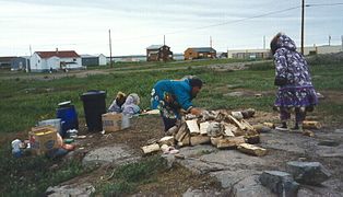 Inuit women preparing to make bannock at Kugluktuk