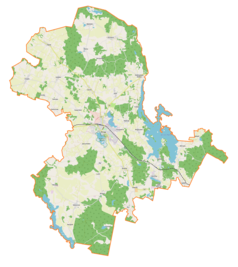 Mapa konturowa gminy Morąg, blisko centrum na prawo znajduje się owalna plamka nieco zaostrzona i wystająca na lewo w swoim dolnym rogu z opisem „Narie”