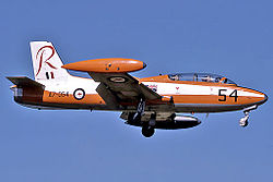 Side view of two-seat, single-engined military jet in flight, wheels down