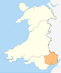 A map of Wales in yellow with a small area in green (about 5%) at the bottom right (south east)